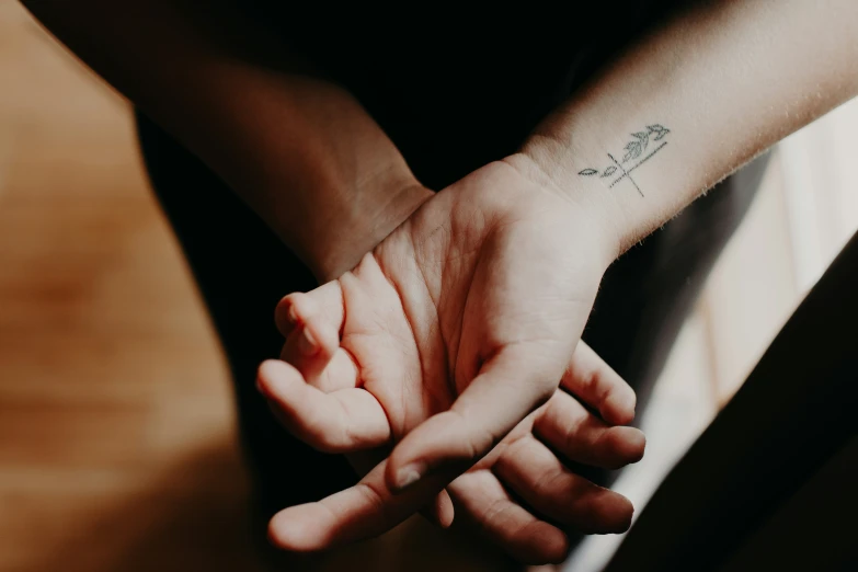 a close up view of someone holding their hand