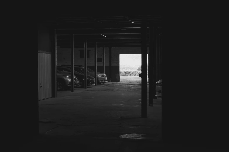 a parking garage with cars parked in it