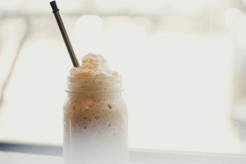 an iced beverage with a straw in it