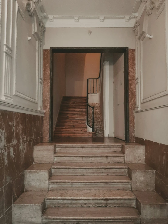stairs and windows lead to a corridor where the rooms are empty