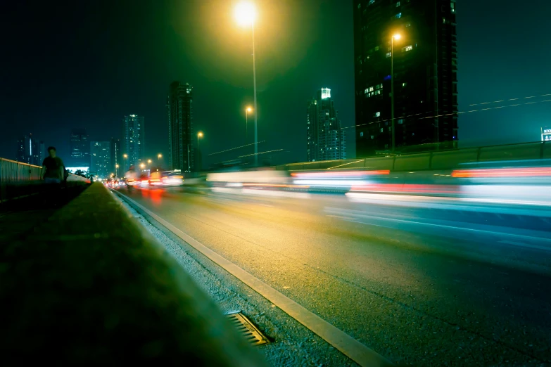 a city street filled with lots of traffic at night