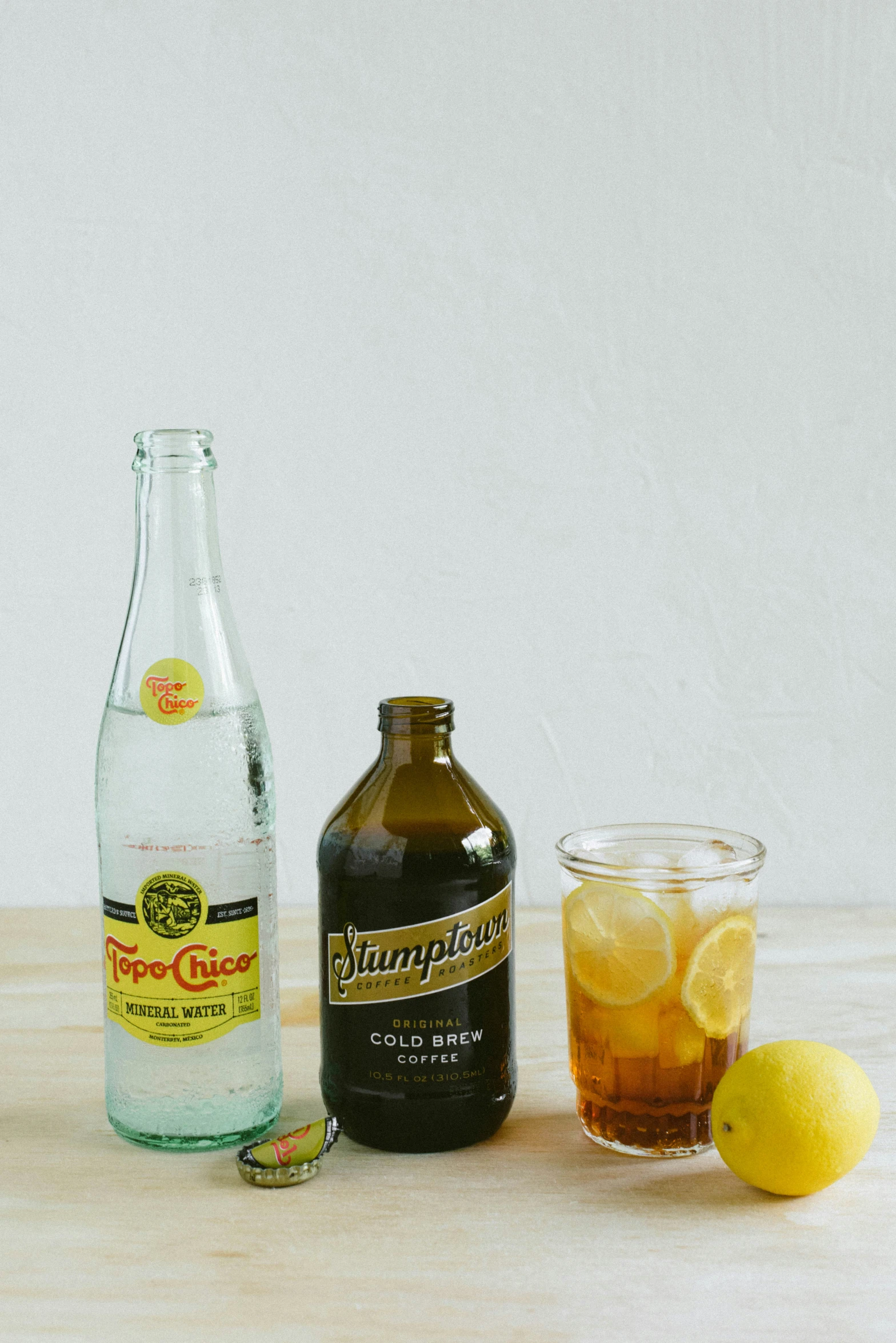 some drinks and lemon on a table