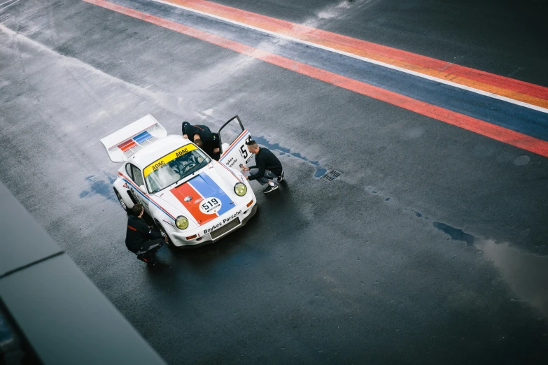 a porsche is seen from above on the road