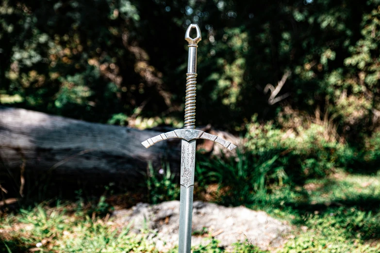 a sword made to look like it is standing in the grass