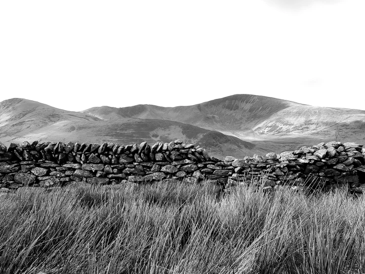 black and white image of hills, and the clouds