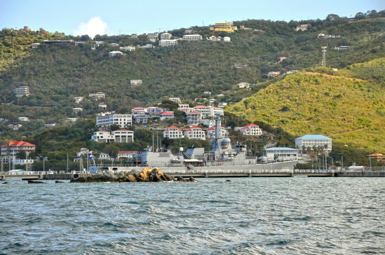 a small ship is sitting out on the water