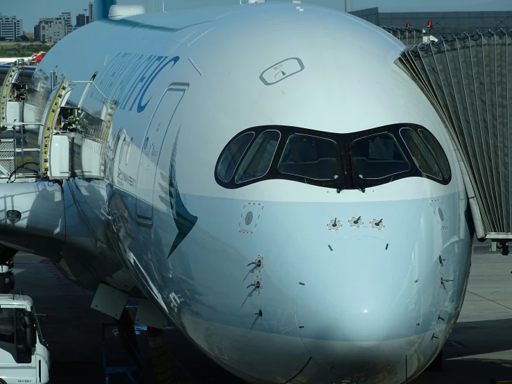 an airplane is docked on the tarmac