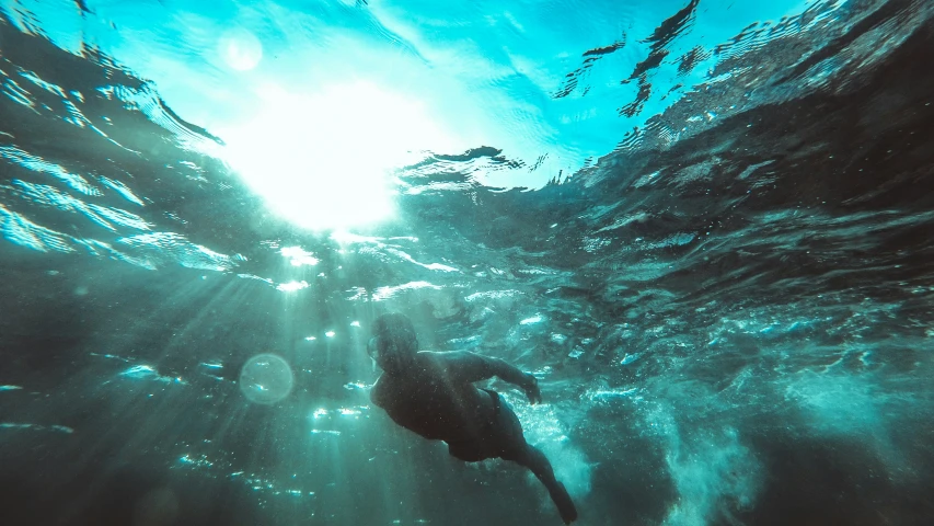 some water bubbles and sunlight shining on the ocean