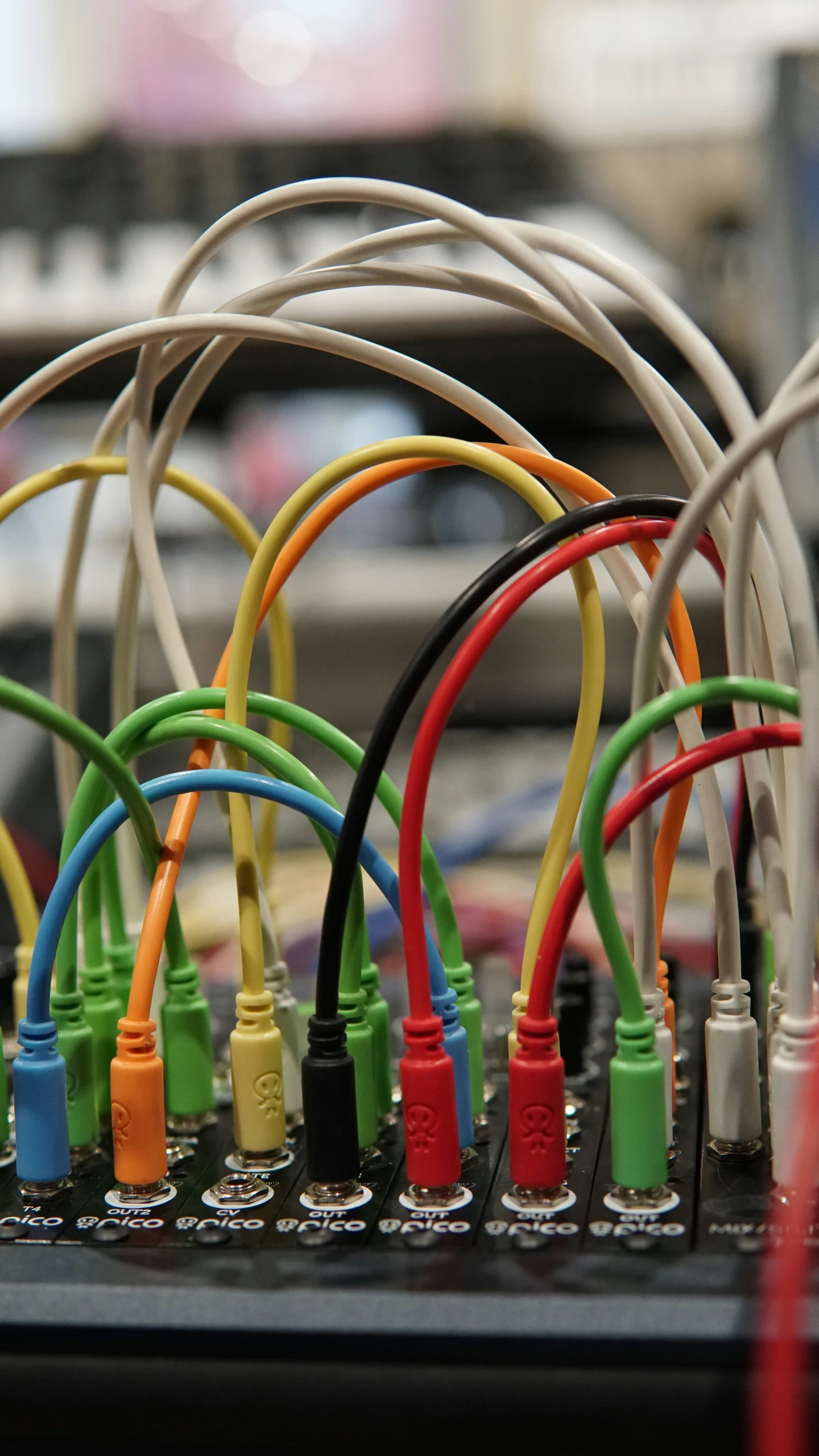 a colorful collection of electrical wires connected to multiple sockets