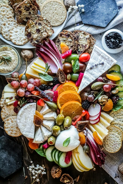 food is laid out with various fruits and cookies