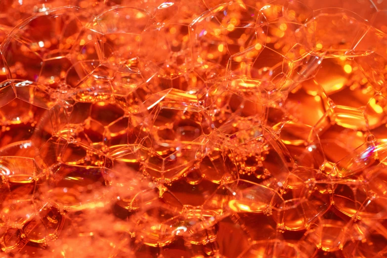 many large pieces of orange glass that are melting