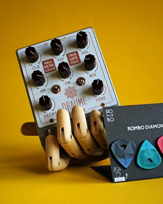 the controls of an analog contraption are made from wooden blocks