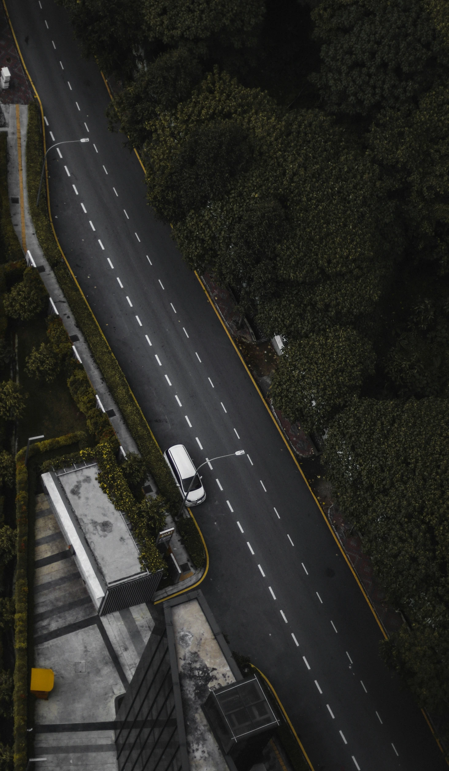 a road and a white truck that is parked on it