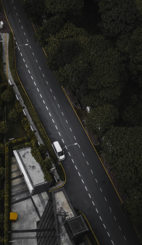 a road and a white truck that is parked on it