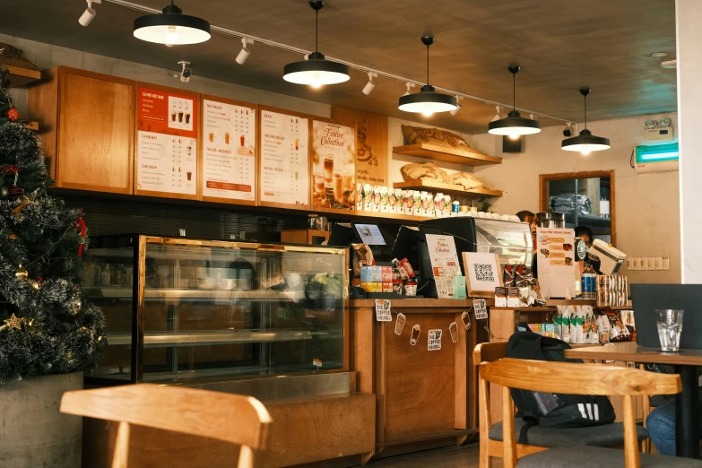 an interior view of a deli restaurant with a christmas tree