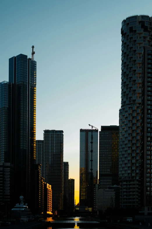 a boat is on the river in front of some tall buildings