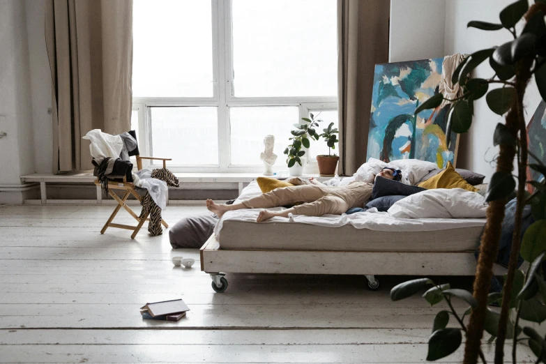 a person lying on a couch in a living room