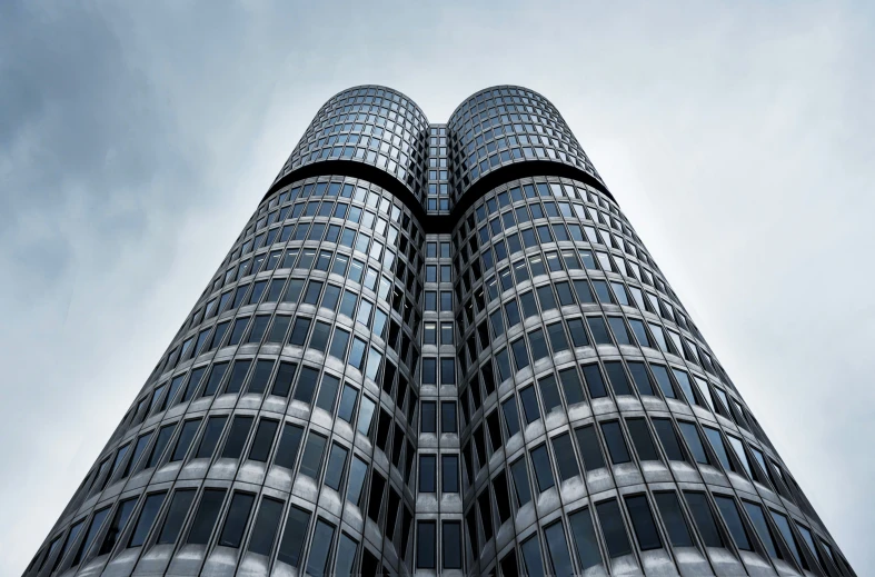 tall buildings reaching up into the sky with clouds