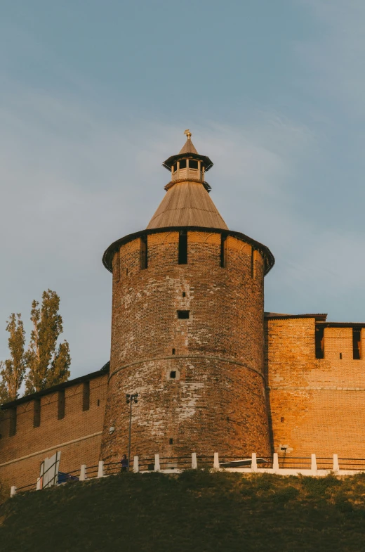 a large brick tower with a dome