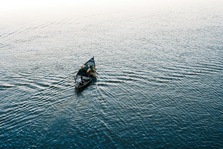 a boat sits in the middle of some water