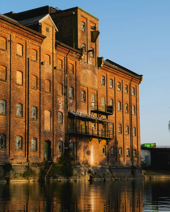 an old factory with lots of windows on top of it