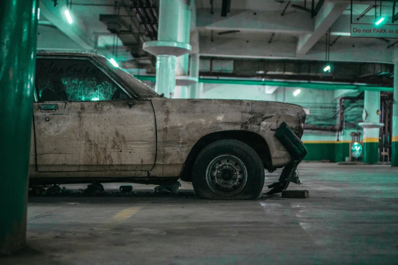 a car is parked inside a large room