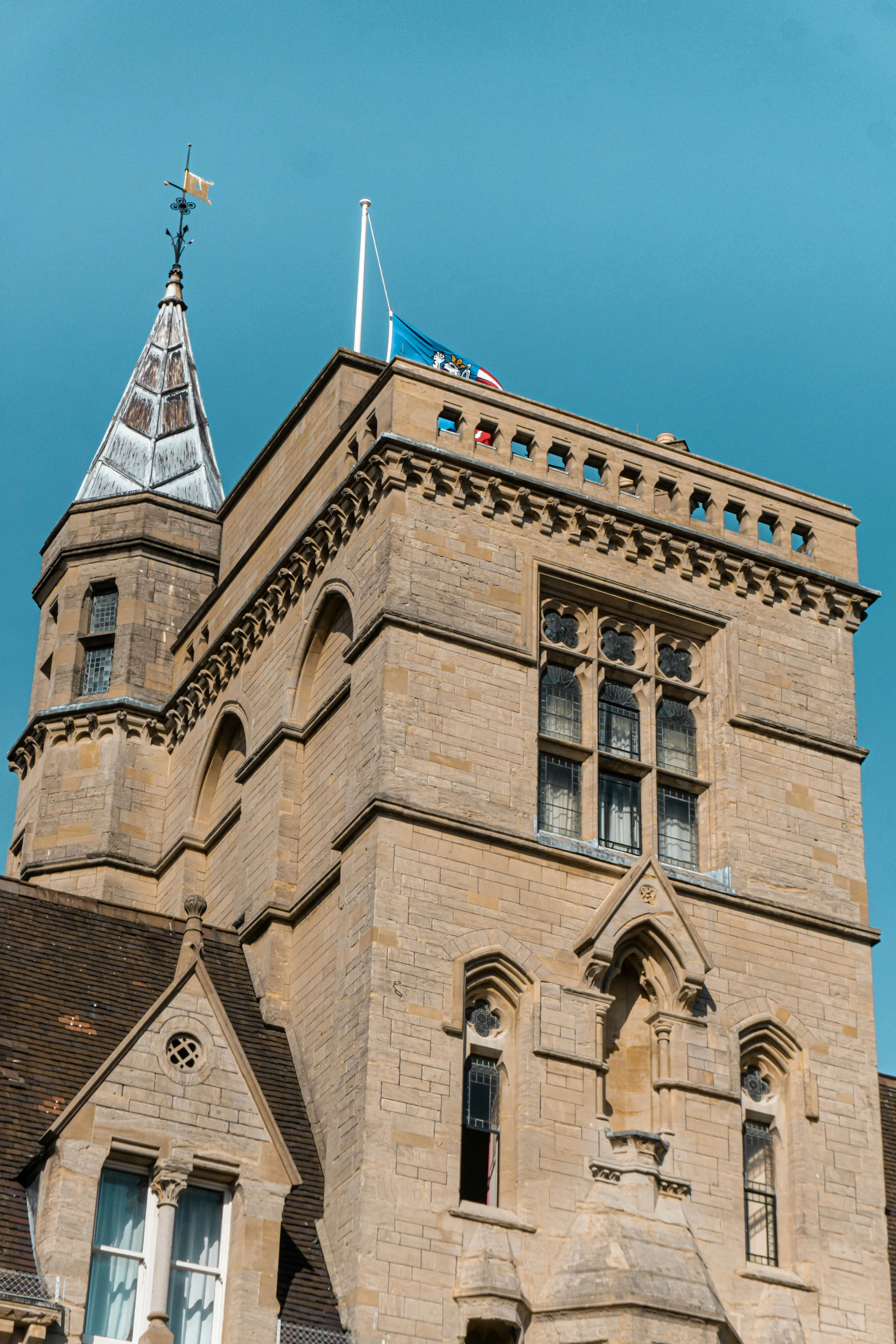 a tall brick tower with some windows and a sky background