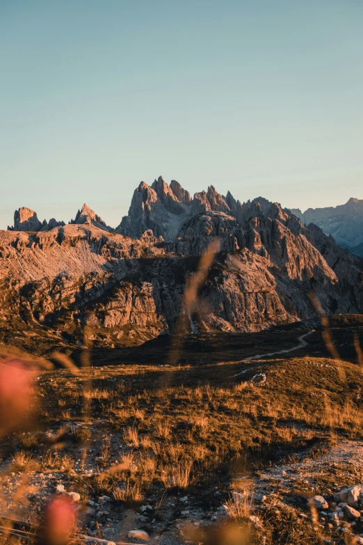 the mountains are rocky with a little bit of snow on them