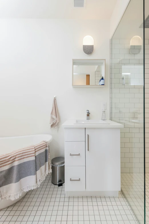 a white bathroom with a black and gray  bath