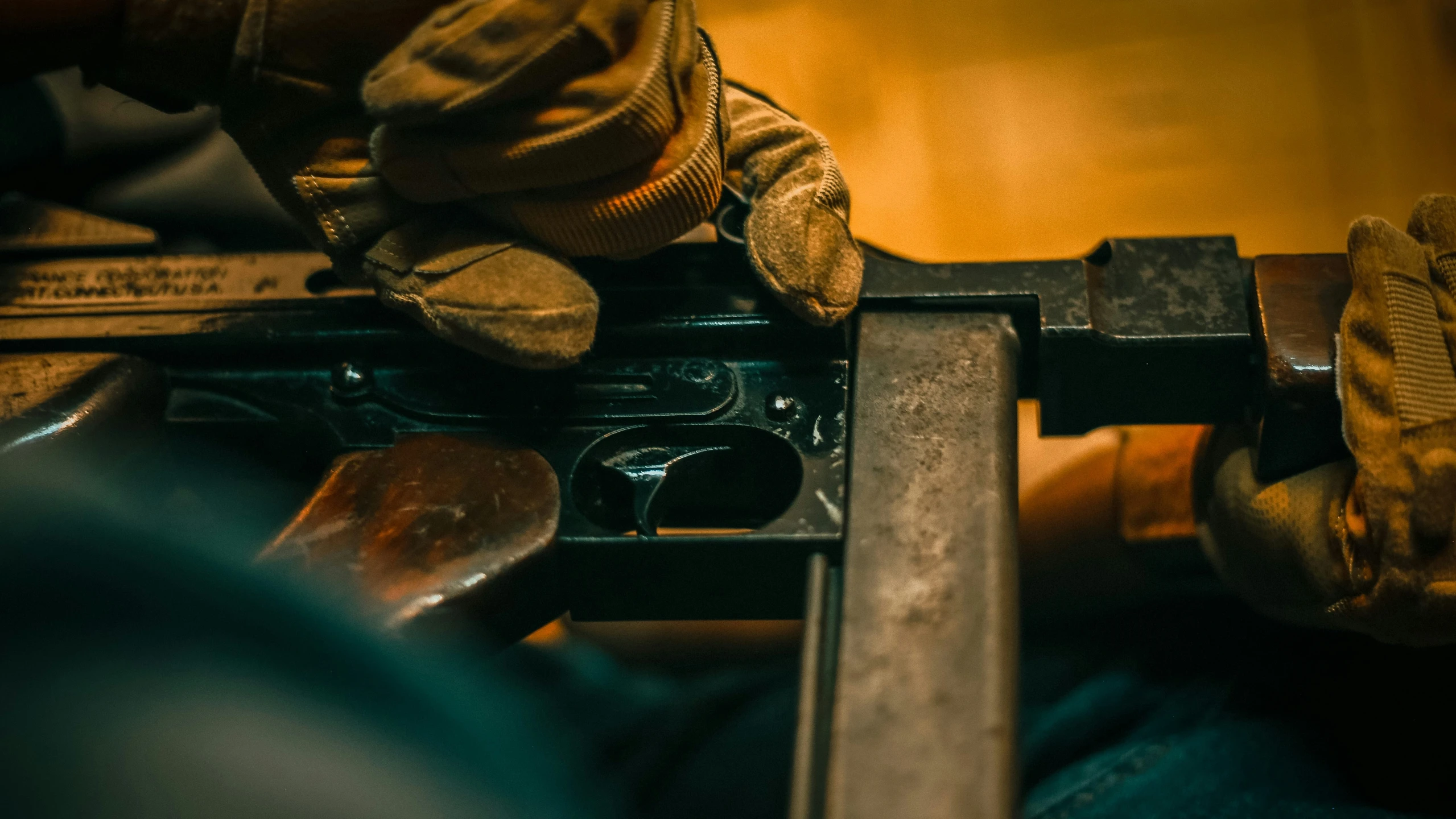 a man sits on his work bench in the dark