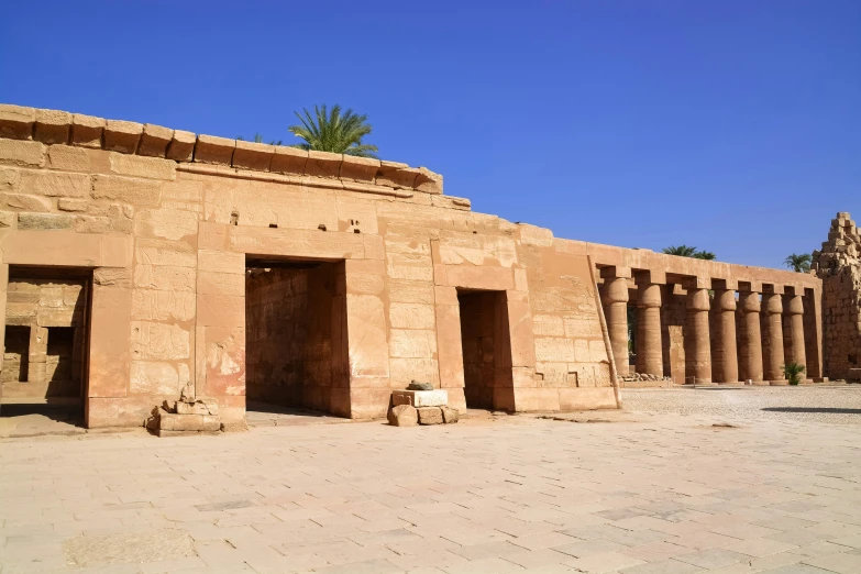 a big stone building sitting inside of a desert