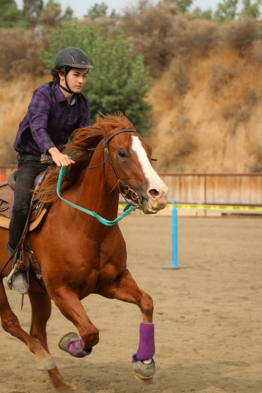 a woman is riding on top of a horse