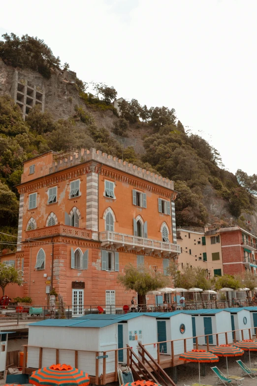 orange buildings are next to each other on the hillside