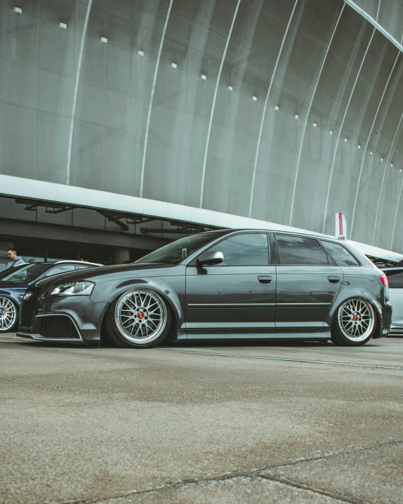 two cars parked in front of a building