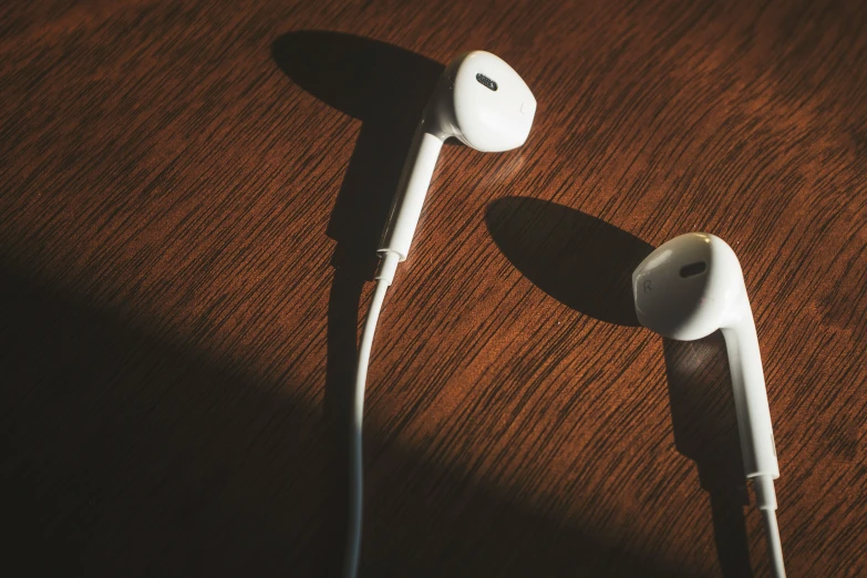 an mp3 player on a table that is partially covered