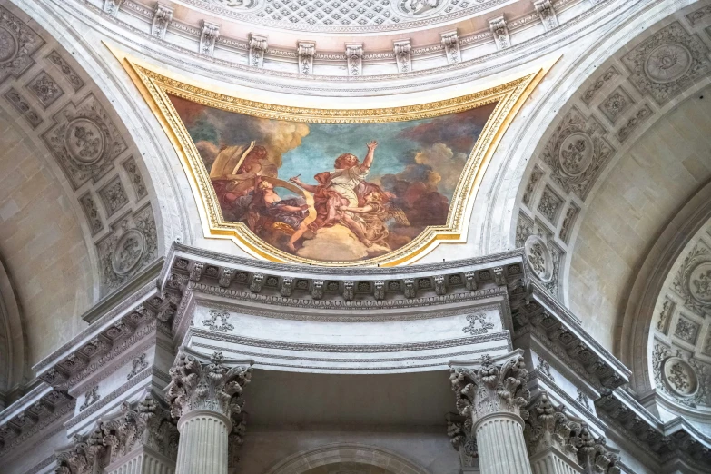 painting on the ceiling of a building with elaborate decoration