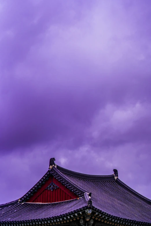 the clouds roll in to a bright purple sky