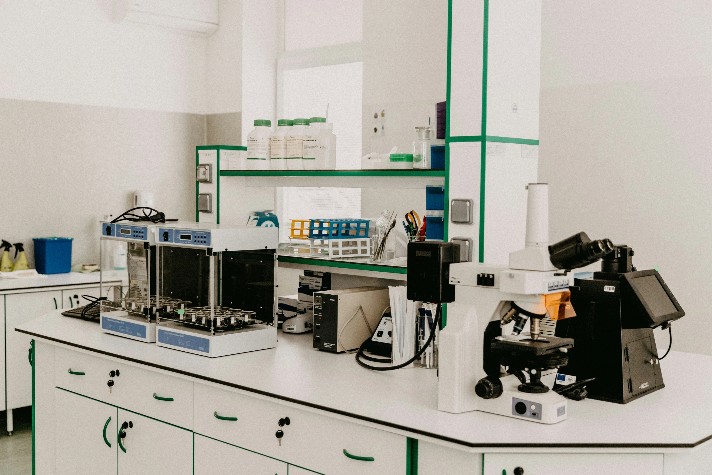 a laboratory filled with lots of equipment on top of a counter