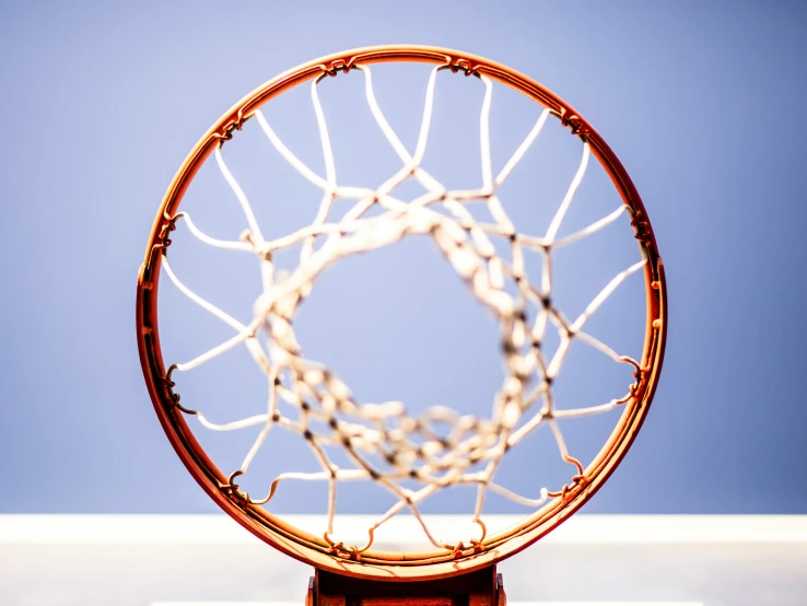 a basketball hoop with a sky in the background