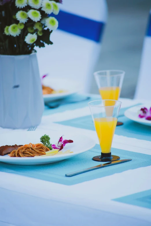 a plate of food on top of a blue and white tablecloth