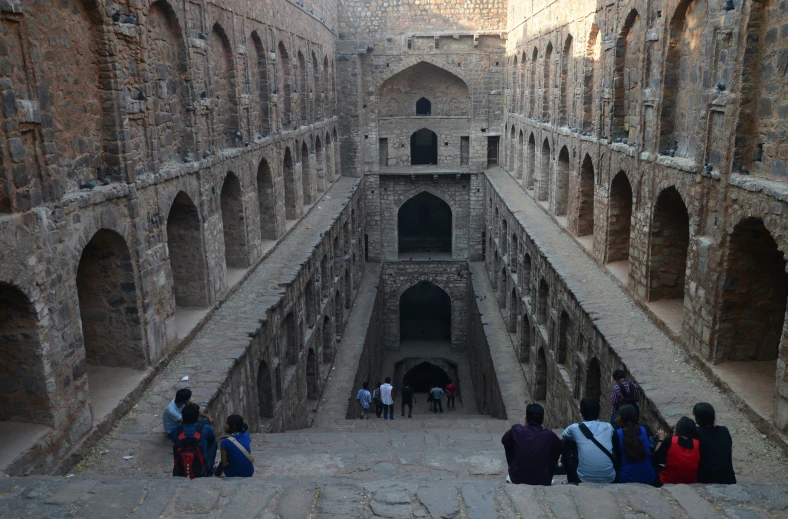 a group of people that are standing around a building