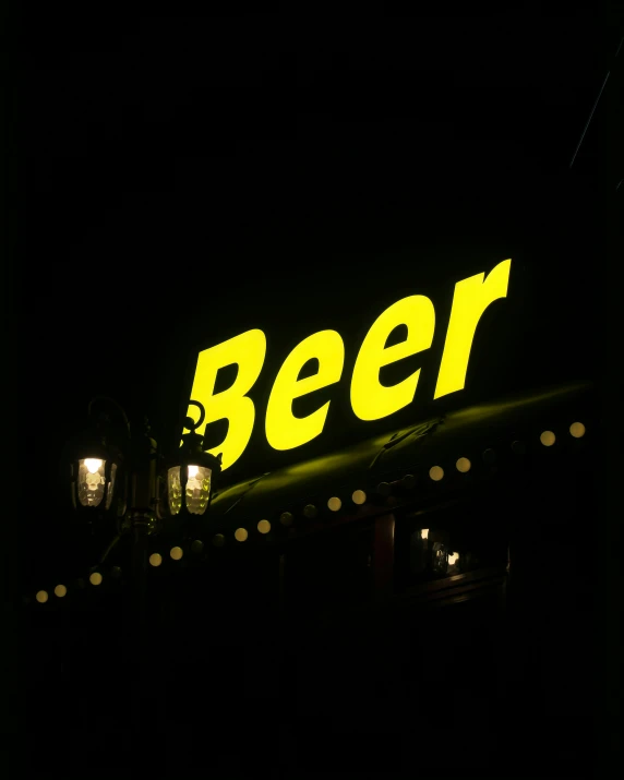 neon sign for beer restaurant lit by lights