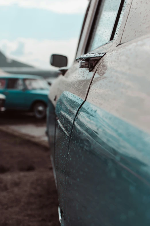 an image of car parked in lot next to other vehicles