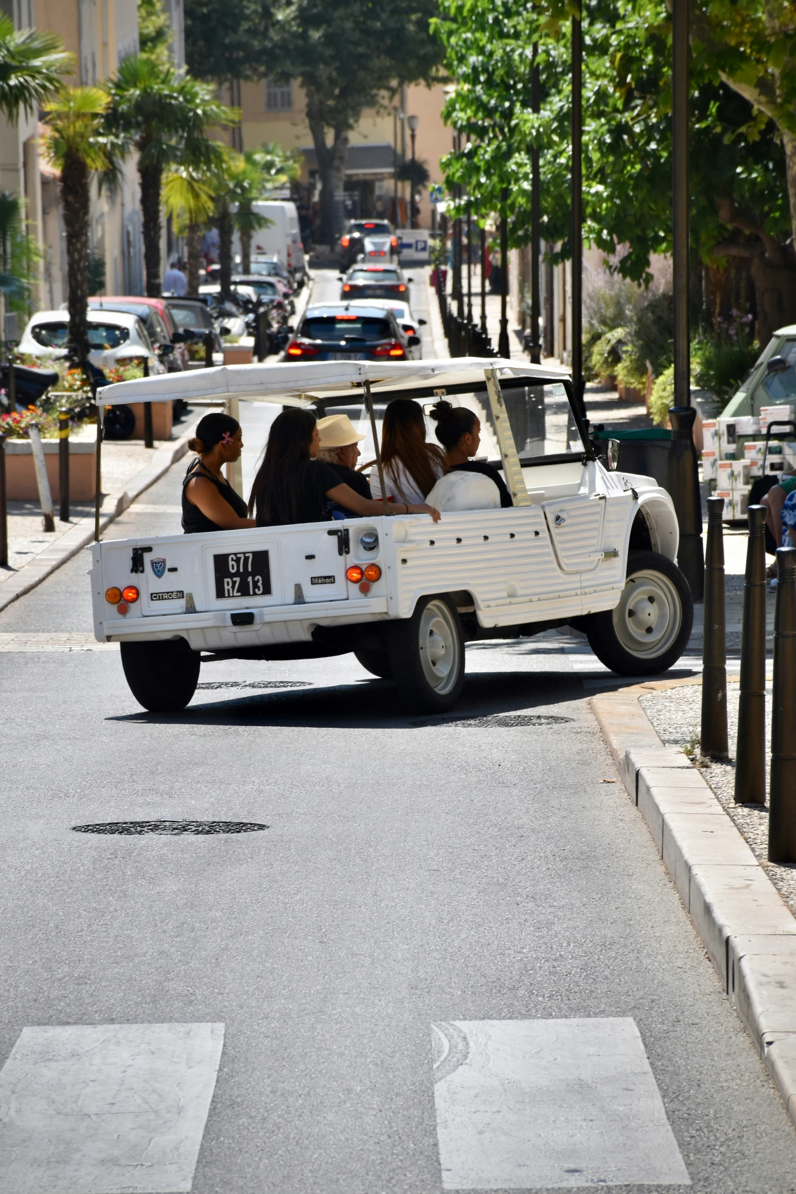 a group of people riding in the back of a white vehicle