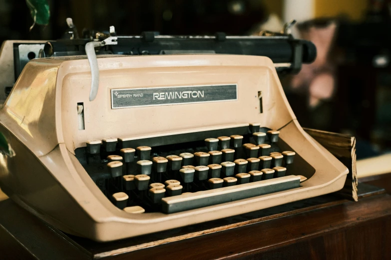 an old fashioned typewriter is next to a man