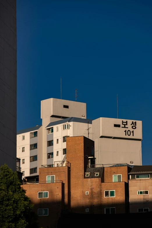 a very tall building sitting in front of trees