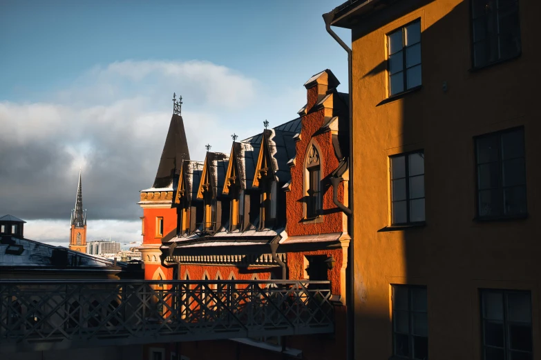 orange buildings with a bridge going between them