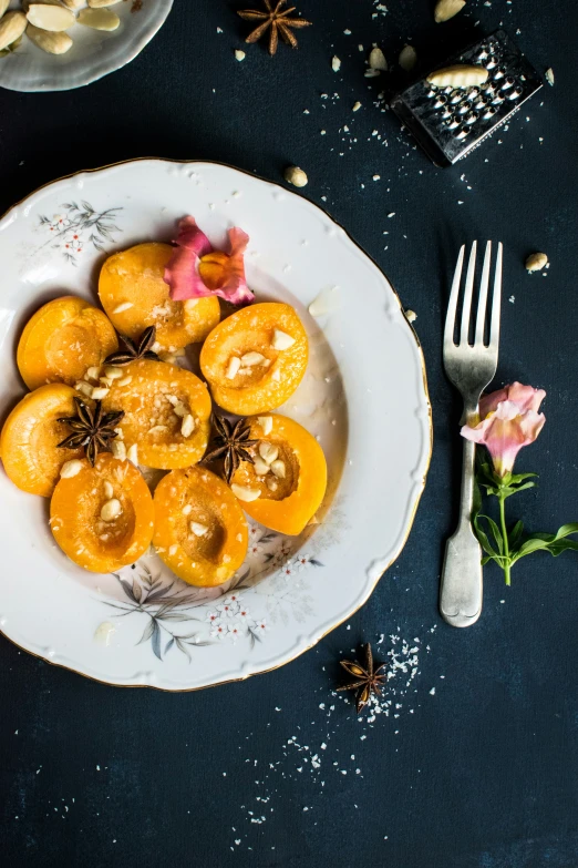 a plate of some oranges with anise and sprinkles