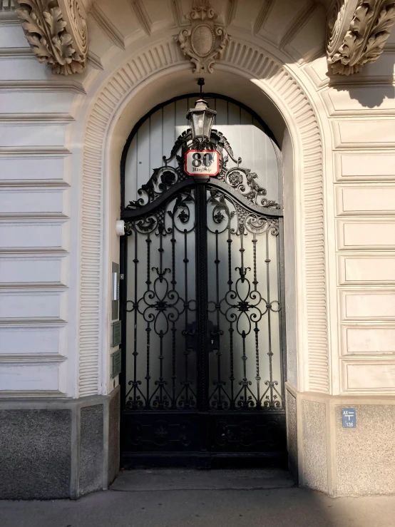 a metal gate is opened and it has a light at the end