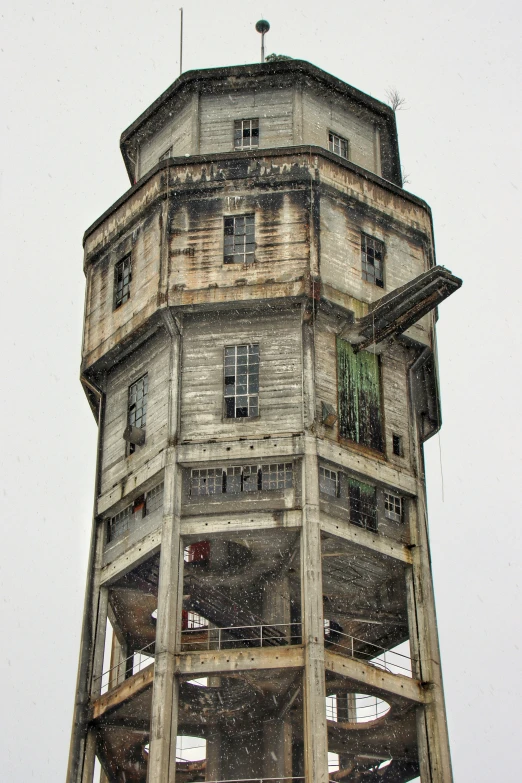 a tower like structure with wooden balconies